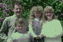family in front of lilacs2.JPG